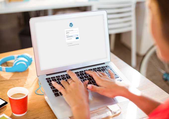 A person changing their WordPress username on a computer